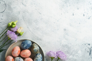 Easter eggs. Dyed Easter eggs with marble stone effect ref and blue color in rustic style on light...