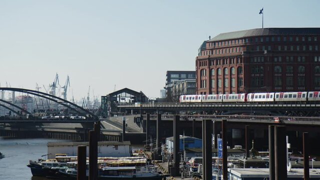 Hochbahn, Metro Train, Subway, moving towards Baumwall Station with the port of Hamburg