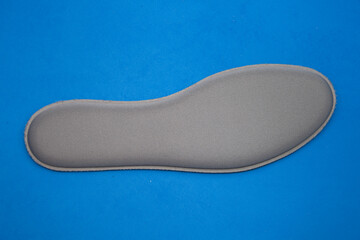  gray Memory Foam  Shoe Insoles on blue  background