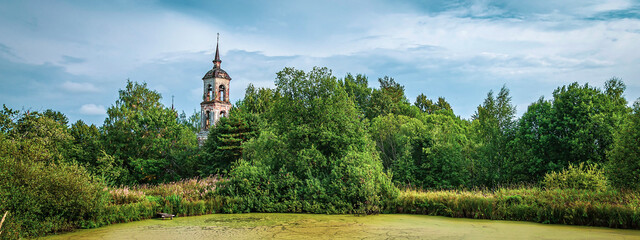 old bell tower by the pond