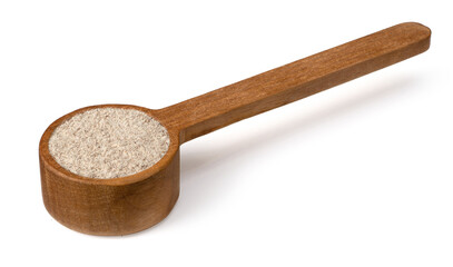 Raw rye flour in the wooden spoon, isolated on white background.