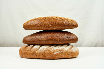 Bread's Pile. Different kinds of bread on white
