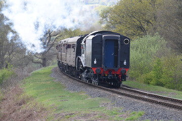 Naklejka premium Sir Nigel Gresley traveling though Devil's Spittleful nature reserve during the Severn valley railway spring steam gala