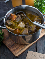 Homemade bone broth cooked with organic beef bones, vegetables and herbs