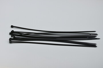 black Cable zip ties,nylon cable tile isolated on black background,