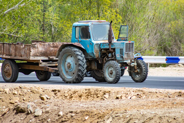 Blue tractor on the road