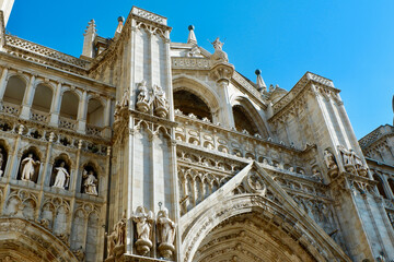 Looking up on the Primatial Cathedral of Saint Mary in Toledo, Spain. Filigree details of the top