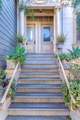 Fototapeta na wymiar Staircase with plants near the railing at the entrance of a house in San Francisco, California