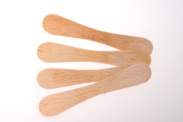 Wooden ice-cream sticks on white background