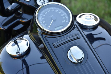 Black motorcycle detail, watch, tank, skull