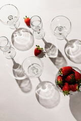 Cocktail glasses and strawberries on the table