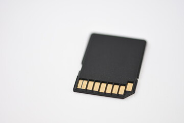 Black microSD memory card and SD card adapter isolated on white