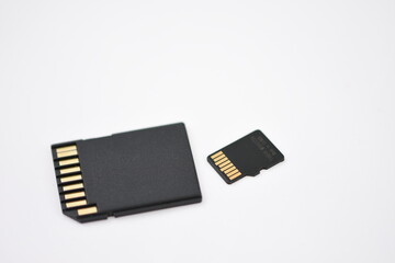 Black microSD memory card and SD card adapter isolated on white