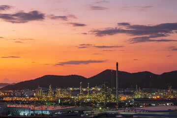 Fototapeta na wymiar Oil​ refinery​ and​ plant of petrochemistry industry in oil​ and​ gas​ ​industry with​ cloud​ ​sky the sunset