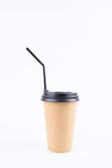 paper cup for coffee with a lid and a straw on a white background
