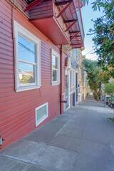 Sloped side walk with concrete slab pavement near the residences at San Francisco, California