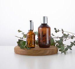 Brown glass bottle for cosmetic liquid products on white background. Template for cosmetics, advertising and promotion