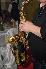 Obraz premium Man plays the saxophone ,