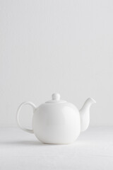 White teapot on a table