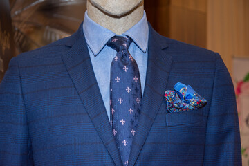 blue suit with tie at an exhibition