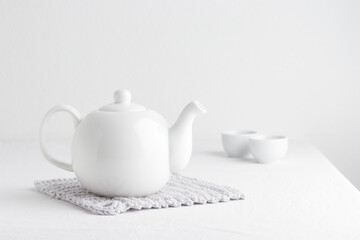 White teapot on a table