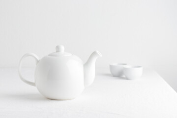 White teapot on a table