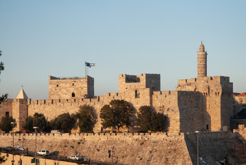 Afternoon view of the landmark, stone Tower of David minaret as golden sunlight strikes the ancient walls of the Old City of Jerusalem. © Yehoshua Halevi