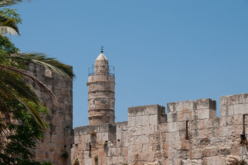 Afternoon view of the landmark, stone Tower of David minaret as golden sunlight strikes the ancient walls of the Old City of Jerusalem. © Yehoshua Halevi