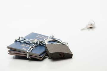 several passports of the citizen of Ukraine with an emblem on a wrapper locked with a chain and...