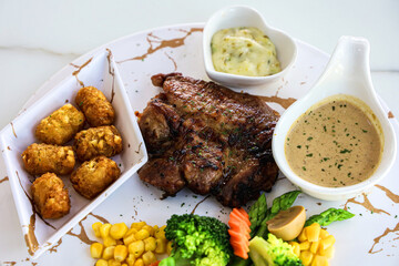 Grilled steaks and vegetables