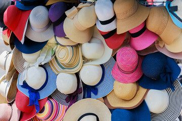Beach hats selling on the city street.