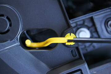 Close up of a new car hood catch