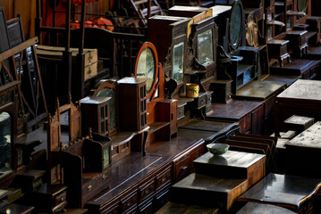 Close-up of furniture placed in a large mahogany furniture store - obrazy, fototapety, plakaty