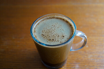 cup of coffee on the wooden table