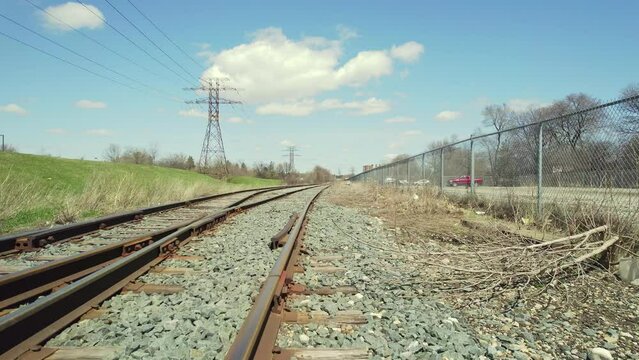 View of railroad track from the bottom of the train. Imitation of train rides at railway track. View from the front of the train. Railway track aerial fpv fast hovering over train rails.