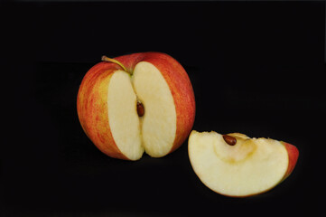 red apple on black background