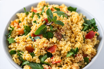 Tabule salad bowl made with chopped parsley, tomatoes, mint, onion, bulgur .Gluten free diet