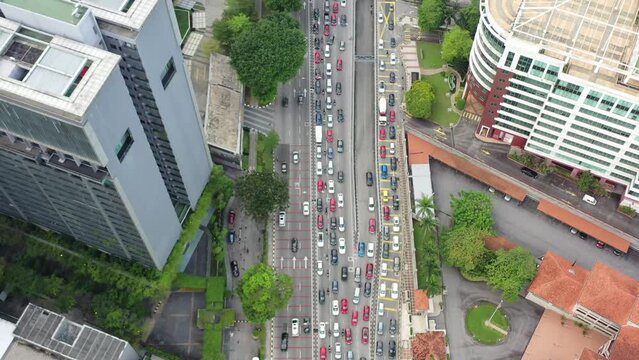 Top down birds eye view capturing the congested traffics on jalan tun razak in downtown kuala lumpur at peak hour, malaysia southeast asia.