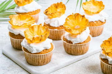 Cupcakes with dried pineapple flowers - Powered by Adobe