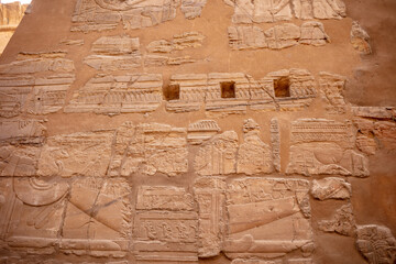 Different hieroglyphs on the walls and columns in the Karnak temple. Karnak temple is the largest complex in ancient Egypt.