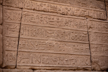 Different hieroglyphs on the walls and columns in the Karnak temple. Karnak temple is the largest complex in ancient Egypt.