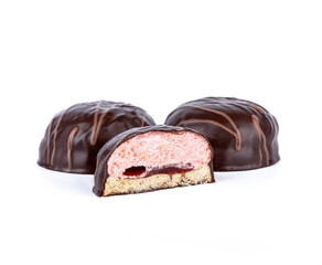 Sweet dessert souffle in chocolate with pink filling.