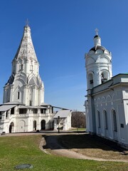 Obraz premium White Russian orthodox church in the park, blue sky, façade of the monastery