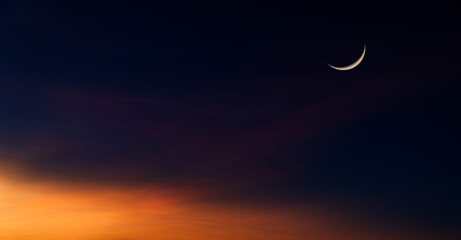 Obraz na płótnie Canvas Crescent moon on dusk sky twilight religion of Islamic and free space for text Eid Al Fitr, Eid Al Adha, Muharram