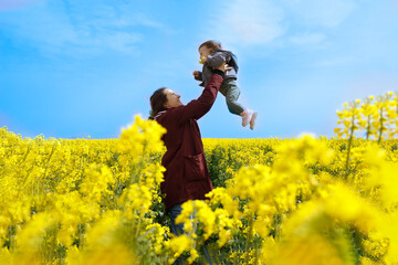 Ukrainian mom and her child in a yellow and blue setting-Ukrainian flag concept