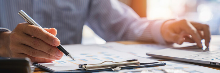 Business man calculating budget numbers, Invoices and financial adviser working.