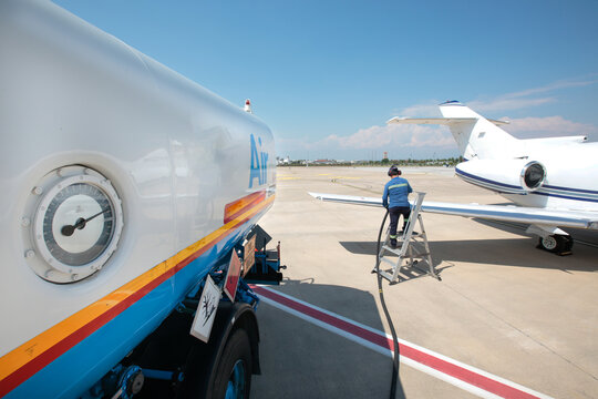 Refueling the jet plane at the airport