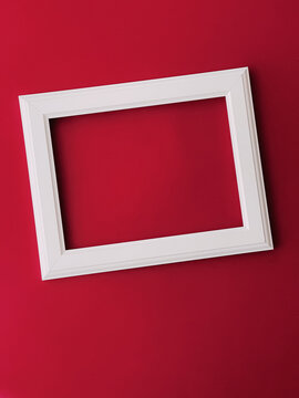 White horizontal art frame on red background as flatlay design, artwork print or photo album