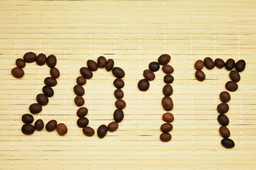 Digit, year, 2017 with coffee bean  on bambus  background