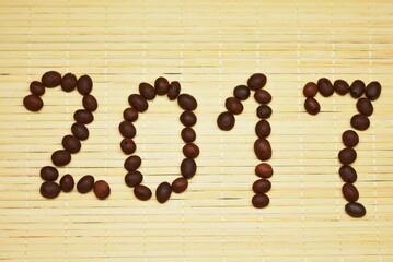 Digit, year, 2017 with coffee bean  on bambus  background